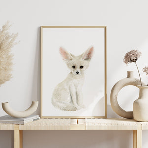 a picture of a baby fennec fox sitting on a table