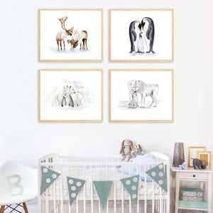 a baby's room with a crib and three pictures of animals