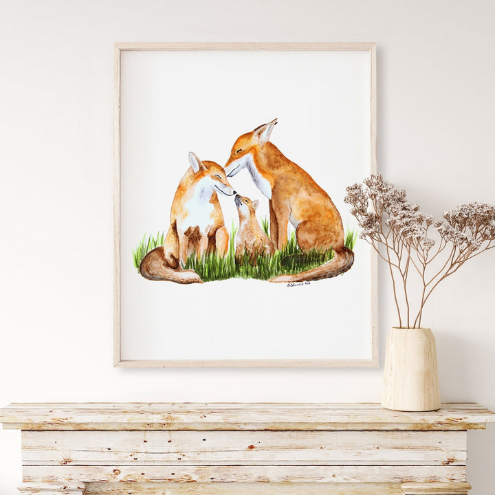 a picture of a couple of foxes sitting next to each other