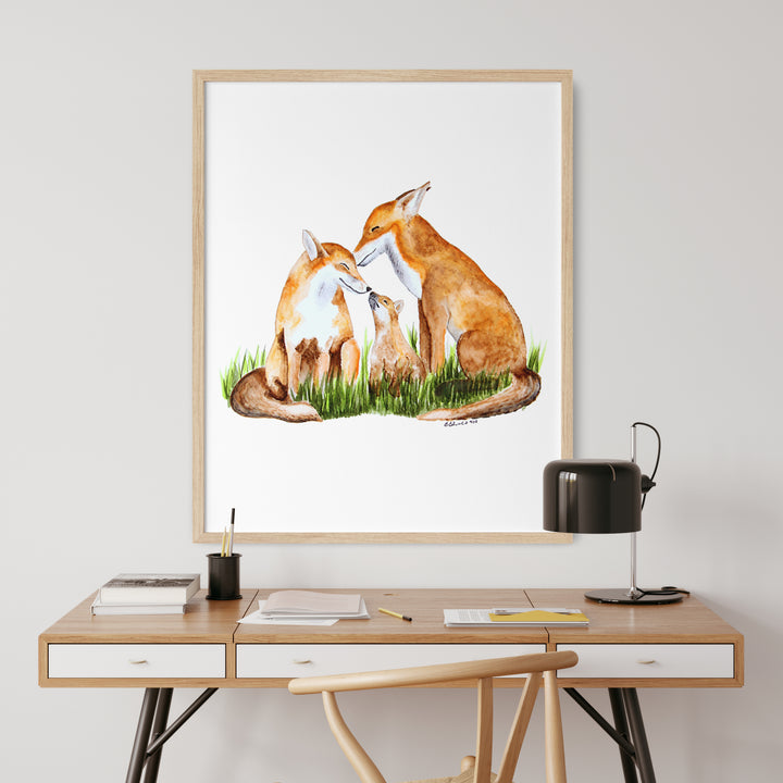 a picture of two foxes sitting on the grass