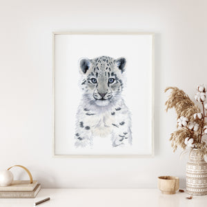 a picture of a snow leopard in a white frame