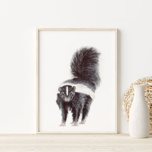 a picture of a skunk on a shelf next to a vase