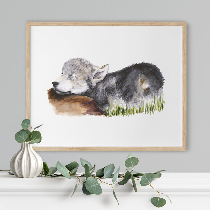 a painting of a wolf laying down in the grass