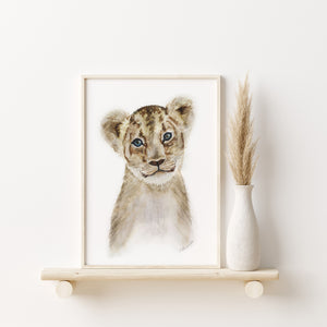 a picture of a lion cub on a shelf