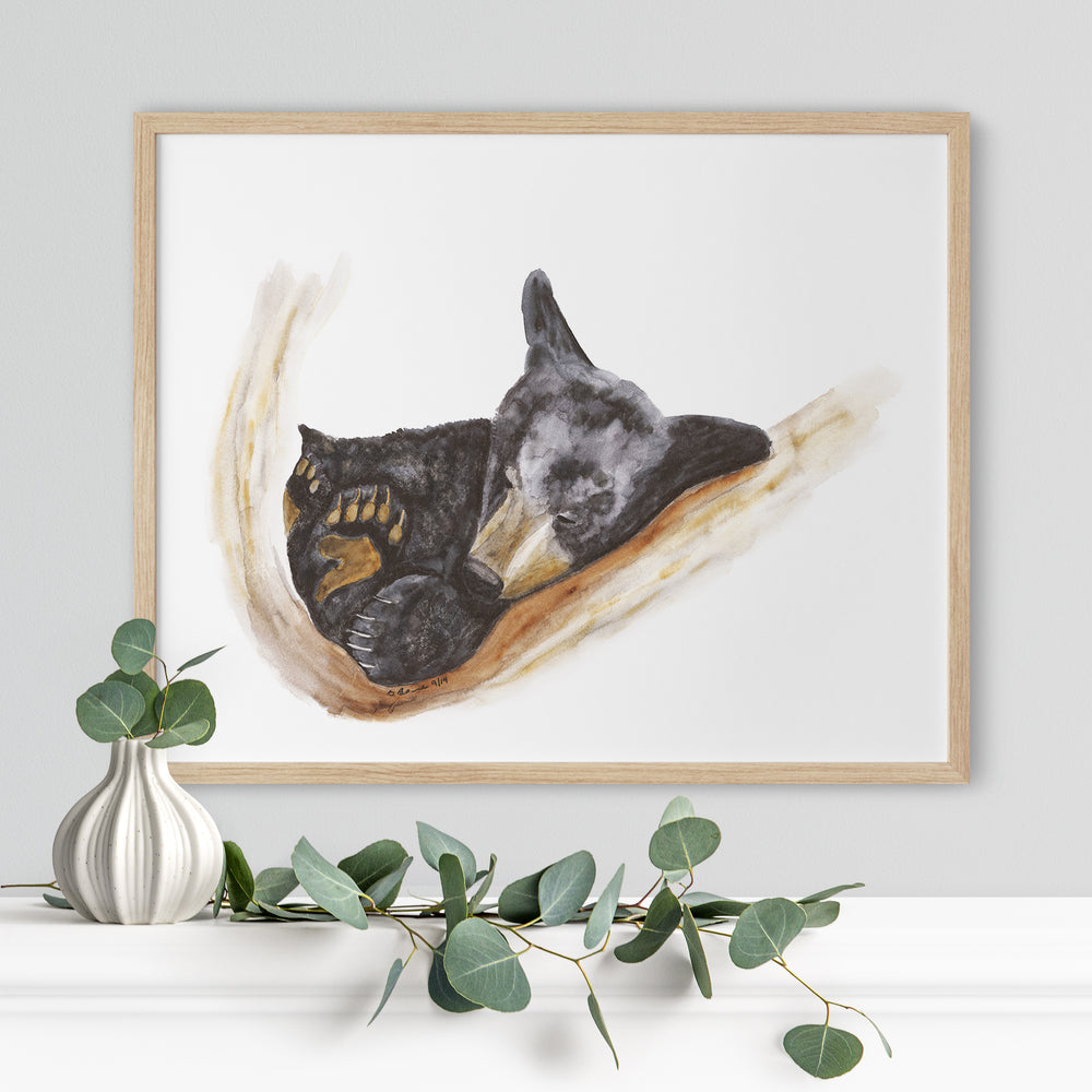 a painting of two dogs laying on a branch