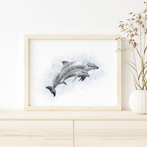 a picture of two dolphins in a watercolor style