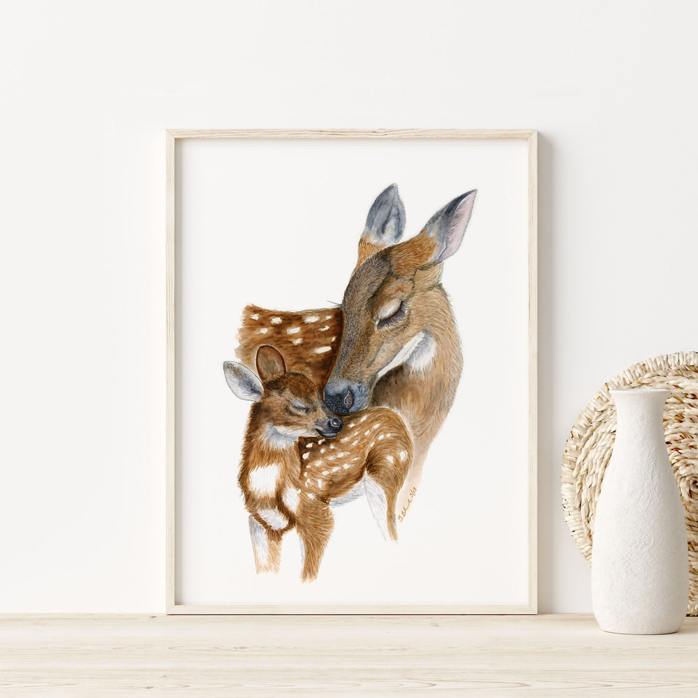 a picture of a deer and a baby deer