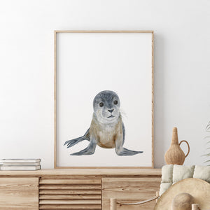 a picture of a seal on a wall above a dresser