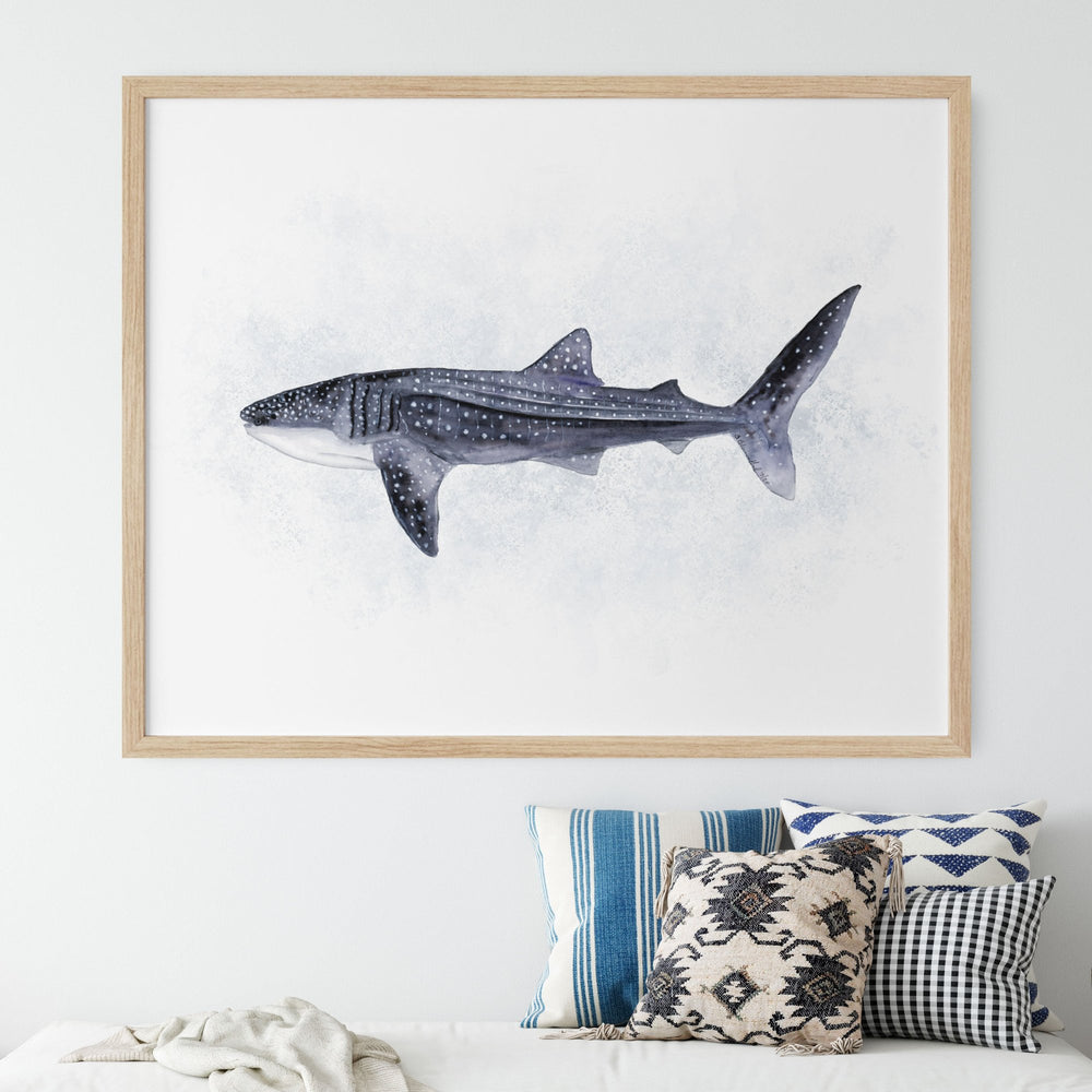 a picture of a whale shark hanging above a bed