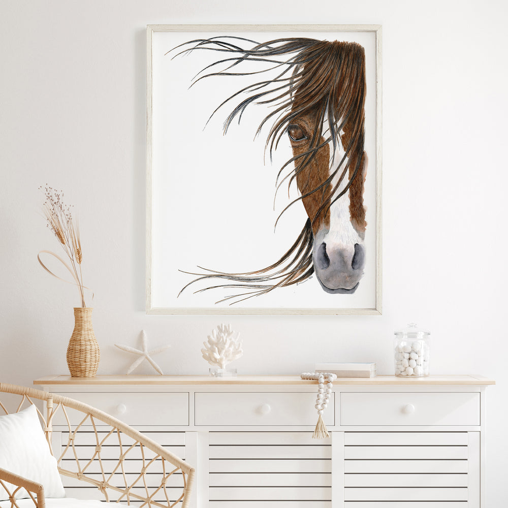 a picture of a horse's head hanging on a wall