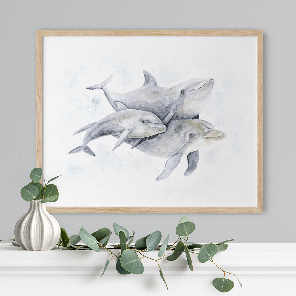 a painting of two dolphins on a mantle