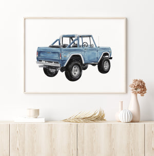 a picture of a blue truck on a white wall