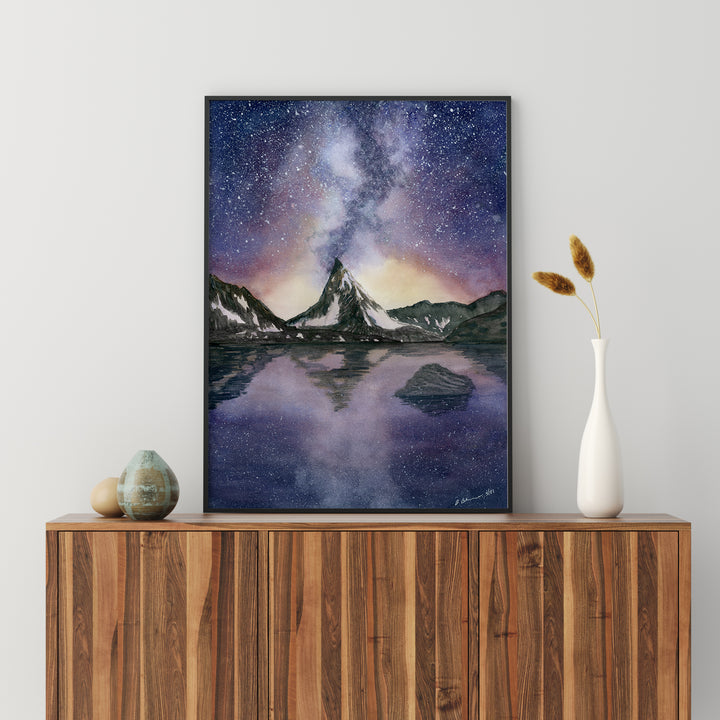 a painting on a wall above a wooden cabinet