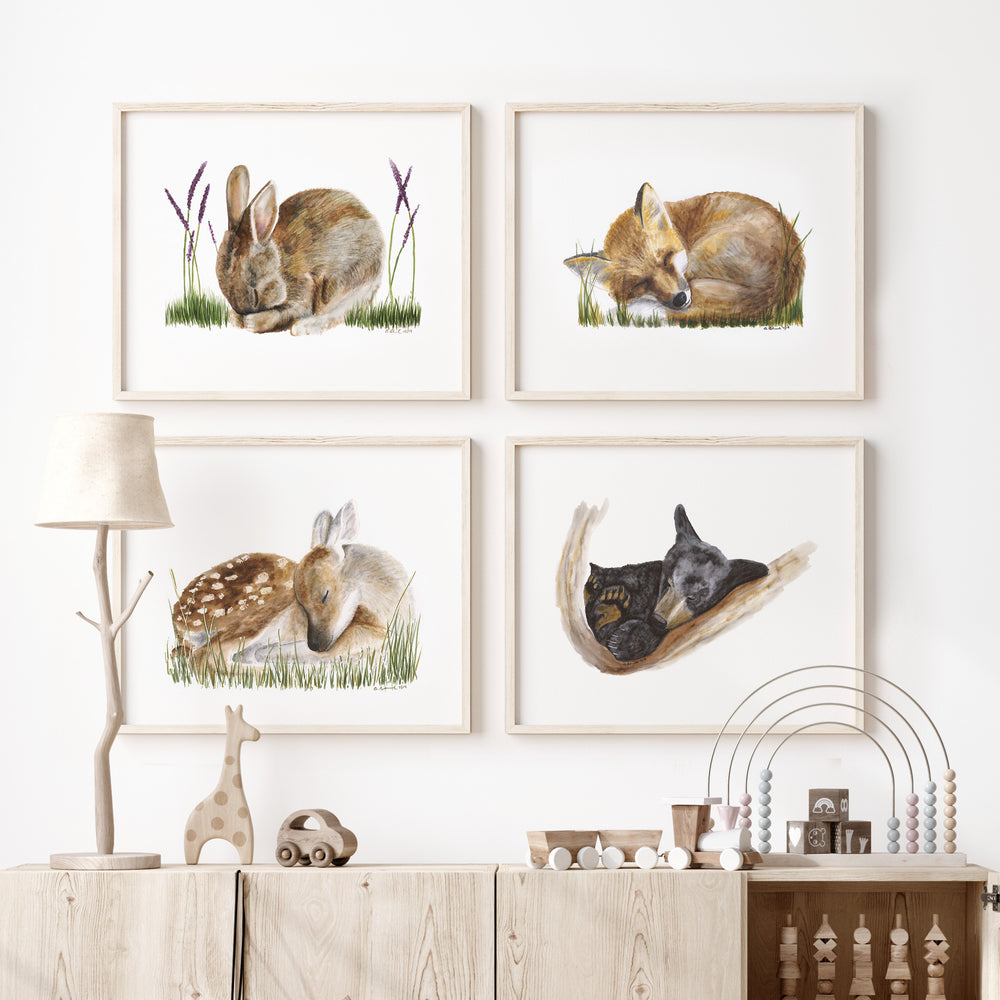 Sleeping woodland animal wall art set displayed in a neutral nursery or kids room