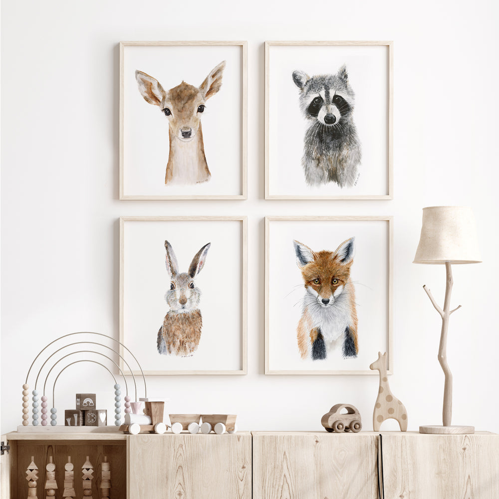 Framed Woodland animal wall art set displayed in a nursery or kids room