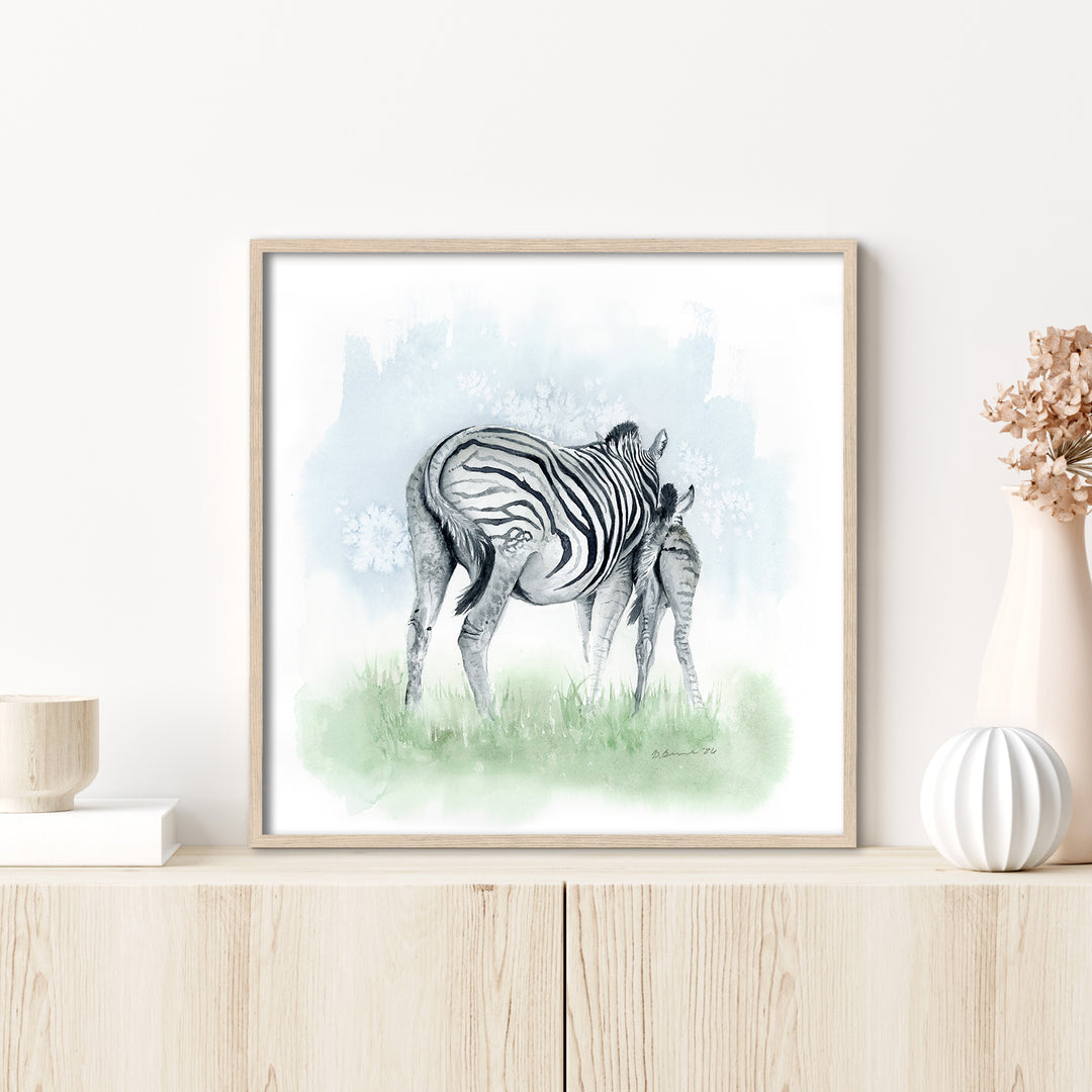 zebra nursery artwork on wall in safari themed baby room