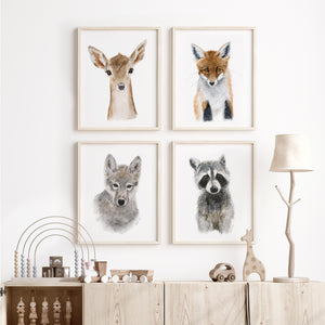 a white wall with three pictures of animals on it