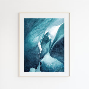 a picture of a glacier in a frame on a wall