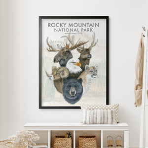 a picture of a mountain national park poster hanging on a wall
