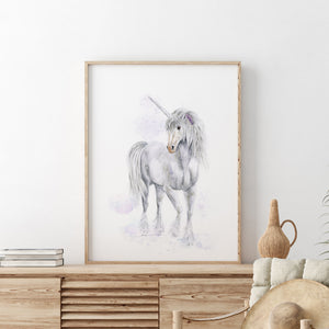 a picture of a unicorn in a frame on a dresser