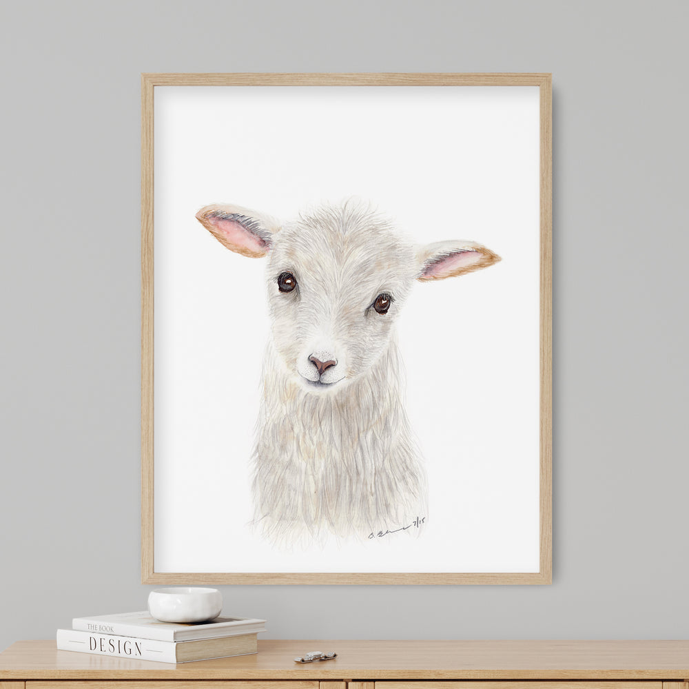 a picture of a sheep is hanging on a wall