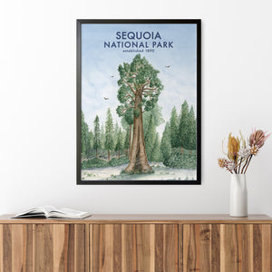 a picture of a national park is hanging on a wall