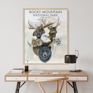a poster of a moose and other animals on a desk