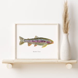 a picture of a fish on a shelf next to a vase