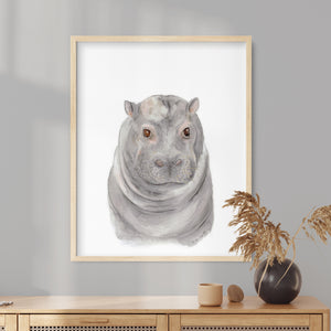 a picture of a hippopotamus in a frame on a wall