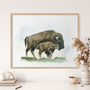 a picture of a bison and her calf