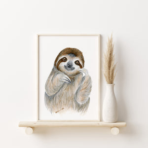 a picture of a sloth hanging on a wall