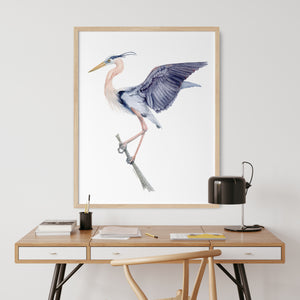 a picture of a bird on a wall above a desk