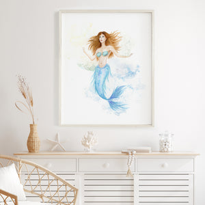 a painting of a mermaid is hanging above a dresser