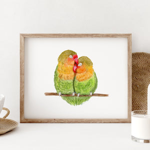 a couple of lovebirds sitting on top of a wooden frame