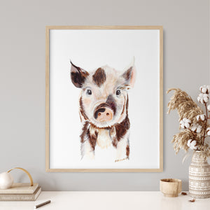 a picture of a pig is hanging on a wall