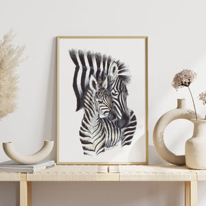 a picture of a zebra and a vase on a table
