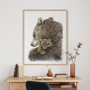 a picture of a bear and cub on a wall