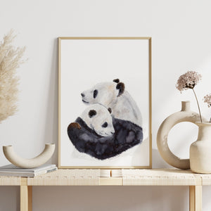 a painting of mom and baby panda bear on a shelf
