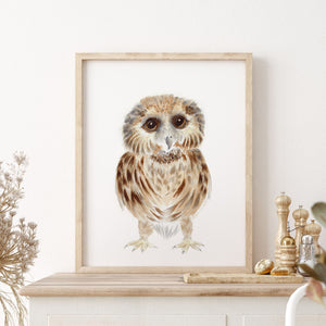 a picture of an baby owl on a mantle