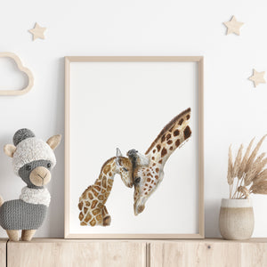 a picture of two giraffes and a stuffed animal