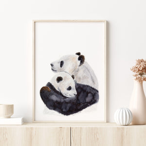 a painting of two panda bears on a shelf