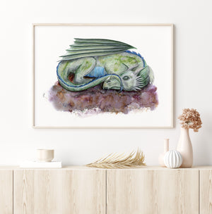 a watercolor painting of a green dragon sleeping on a rock