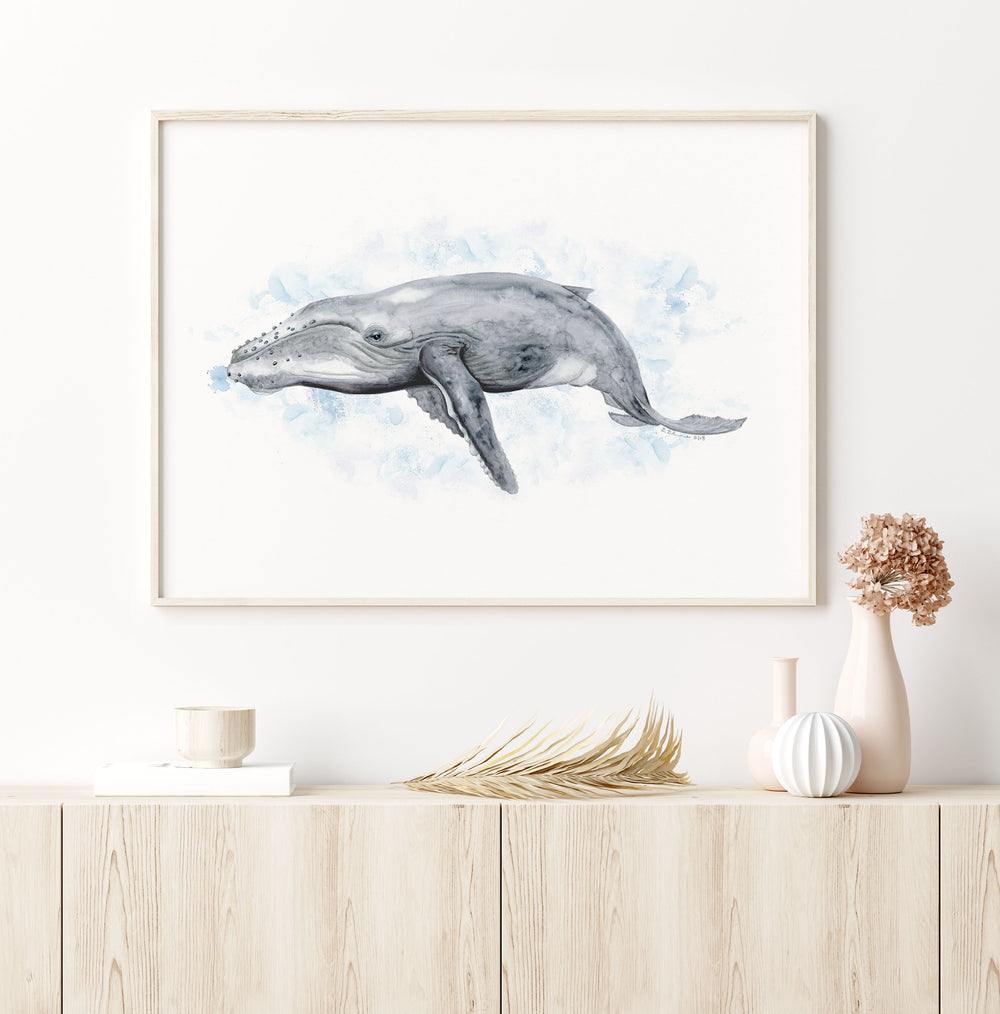 a painting of a humpback whale on a white wall