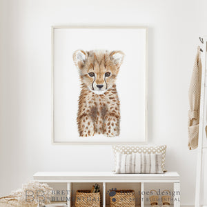 a picture of a baby cheetah in a white room