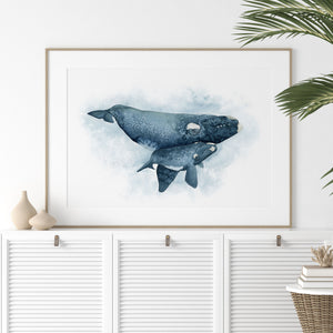 a picture of a whale with a baby on its back