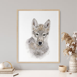 a picture of a wolf is hanging on a wall