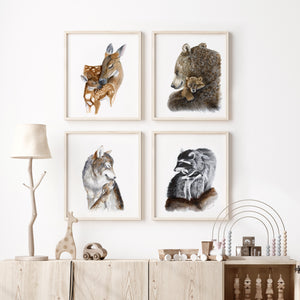 a white room with four framed pictures of animals on the wall