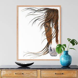 a picture of a horse's head in a frame next to a blue vase
