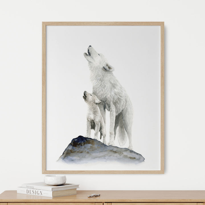 a picture of a wolf and her pup howling