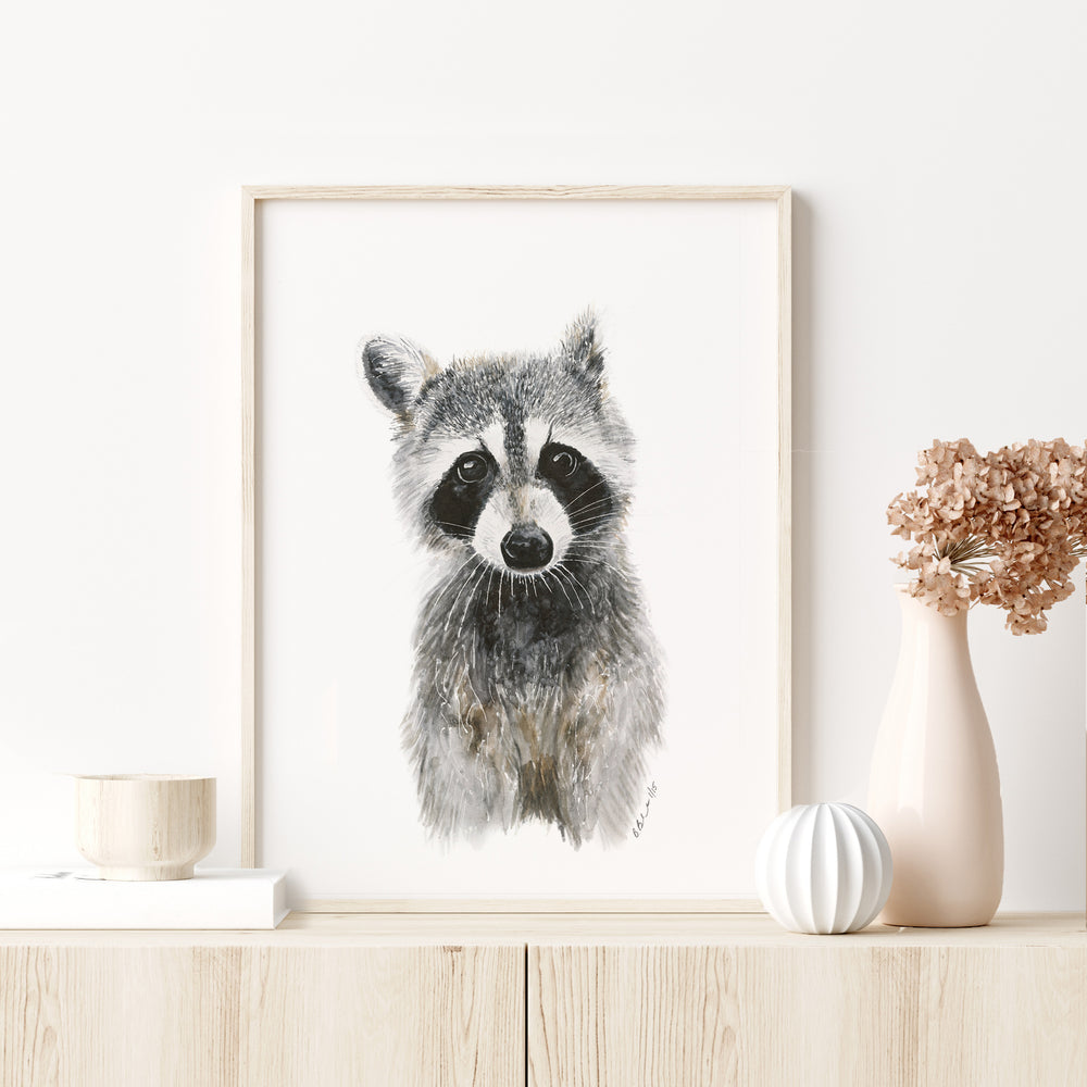 a picture of a raccoon on a shelf